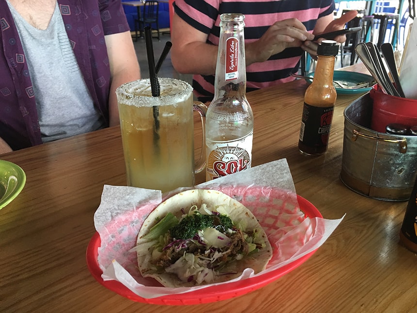 Delicious taco with a tall drink to match, perfect